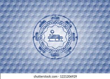 bench press icon inside blue emblem or badge with abstract geometric polygonal pattern background.