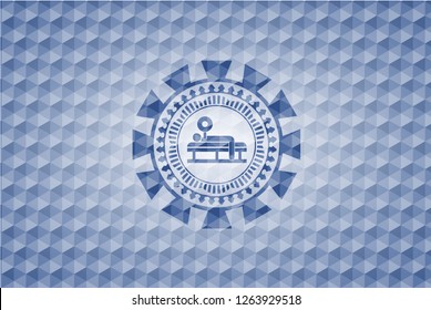 bench press icon inside blue polygonal emblem.