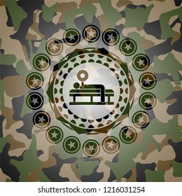 bench press icon inside camouflage emblem