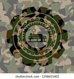 bench press icon inside camouflage emblem