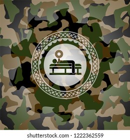 bench press icon inside camouflaged emblem