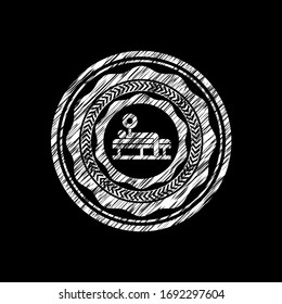 bench press icon inside chalk emblem written on a blackboard