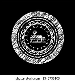 bench press icon inside chalkboard emblem on black board