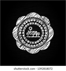 bench press icon inside chalkboard emblem on black board
