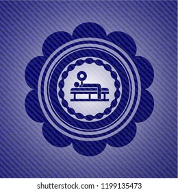 bench press icon inside emblem with jean background