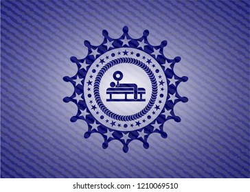 bench press icon inside emblem with jean texture