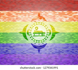 bench press icon inside emblem on mosaic background with the colors of the LGBT flag