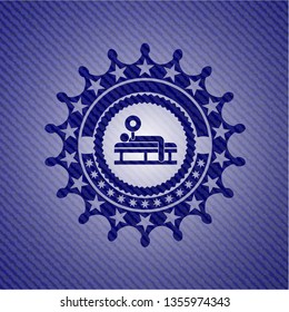 bench press icon inside emblem with jean background