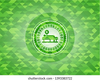 bench press icon inside green mosaic emblem