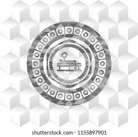 bench press icon inside grey emblem with cube white background