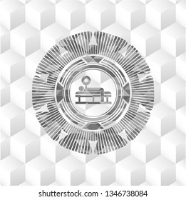 bench press icon inside grey badge with geometric cube white background