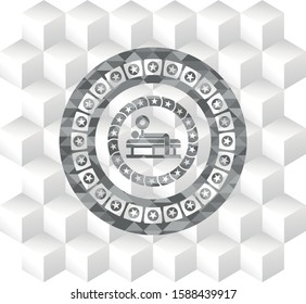 bench press icon inside grey emblem with cube white background