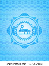 bench press icon inside light blue water wave badge.