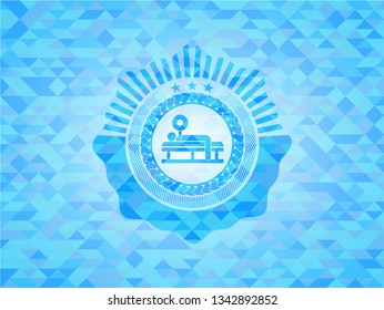 bench press icon inside light blue emblem with triangle mosaic background
