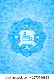 bench press icon inside light blue emblem with mosaic background
