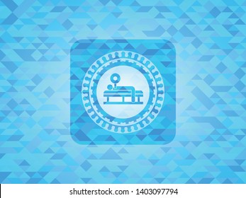 bench press icon inside light blue emblem with mosaic background