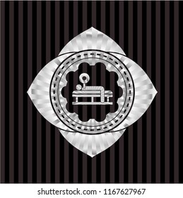 bench press icon inside silver badge or emblem