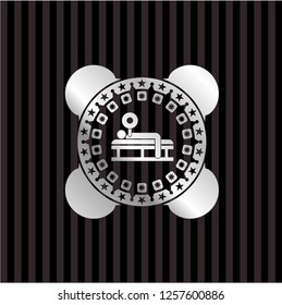 bench press icon inside silver emblem