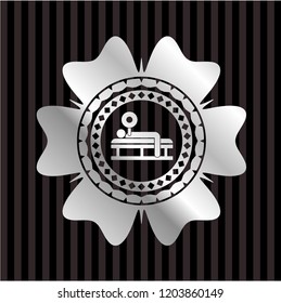 bench press icon inside silvery emblem or badge