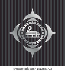 bench press icon inside silvery badge or emblem