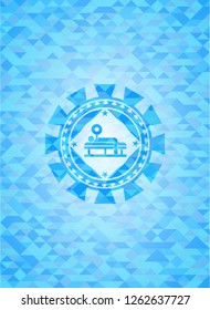 bench press icon inside sky blue emblem with mosaic background