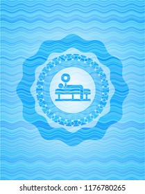 bench press icon inside water wave emblem background.