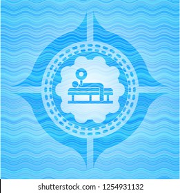 bench press icon inside water wave emblem background.