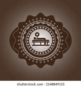 bench press icon inside wood badge or emblem. 