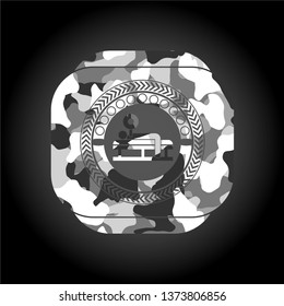 bench press icon on grey camouflaged texture