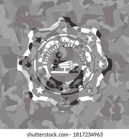 bench press icon on grey camouflaged texture. 