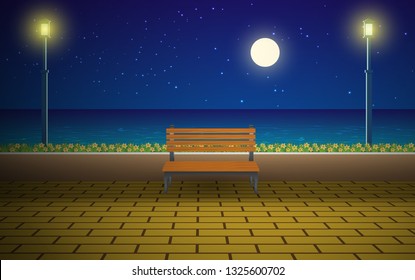 Bench at walkway on the beach in night