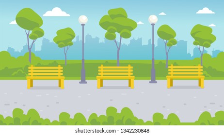 Benches and lanterns in the city park. Landscape: park path, green lawn, trees, bushes, city on the horizon.
