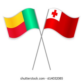 Beninese and Tongan crossed flags. Benin combined with Tonga isolated on white. Language learning, international business or travel concept.