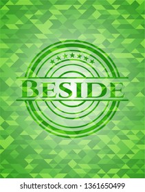 Beside green emblem with triangle mosaic background