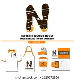 The Best and Delicious Letter N Donuts Shop Logo for Cafe and Bakery. Bitten Chocolate Donut with Initial Lettering Logotype Vector Illustration on White Background 