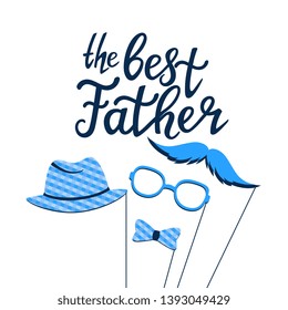 The Best Father hand drawn lettering. Greeting card with photo props on a stick: a mustache, glasses, hat, bow tie