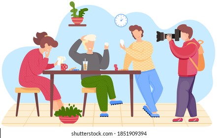 Best friends take a group photo. Young man taking pictures of people playing cards. Friends are drinking a juice and coffee at the table. Сomrades are having a good time visiting one of them
