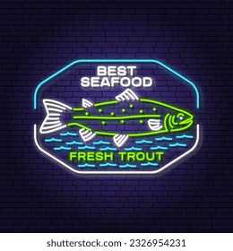 Best seafood neon sign. Fresh trout. Vector illustration. For seafood emblem, sign, patch, shirt, menu restaurants, fish markets, stores. Neon sign, bright signboard light banner.