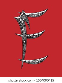 Beveled letter with coarse surface on red background.