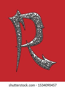 Beveled letter with coarse surface on red background.