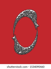 Beveled letter with coarse surface on red background.