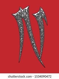 Beveled letter with coarse surface on red background.