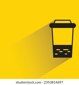 beverage cup with shadow on yellow background