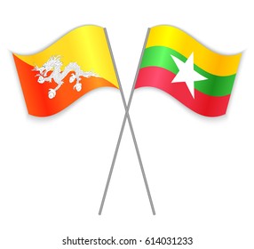 Bhutanese and Burmese crossed flags. Bhutan combined with Burma isolated on white. Language learning, international business or travel concept.