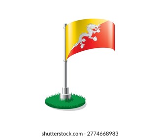 Bhutanese flag on a flagpole mounted on the grass