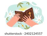 Bible with christian crucifix in hands of man studying catholic canons from books describing gospel. Flowers around holy bible or prayer book for development spirituality and search for meaning life