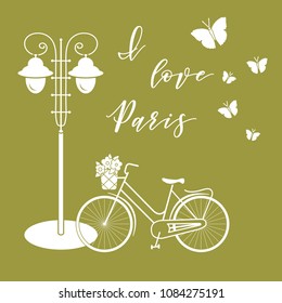 Bicycle with a basket of flowers, lantern, butterflies. The inscription I love Paris. Travel and leisure.