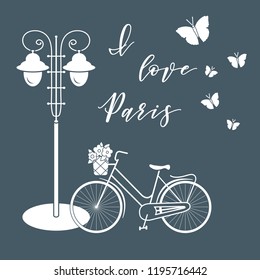 Bicycle with a basket of flowers, lantern, butterflies. The inscription I love Paris. Travel and leisure.