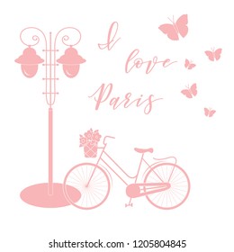 Bicycle with a basket of flowers, lantern, butterflies. The inscription I love Paris. Travel and leisure.