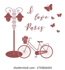 Bicycle with a basket of flowers, lantern, butterflies. The inscription I love Paris. Travel and leisure.